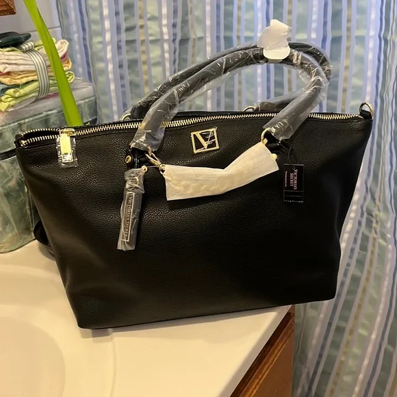 Black mid size VS purse with gold hardware - Picture 1 of 5